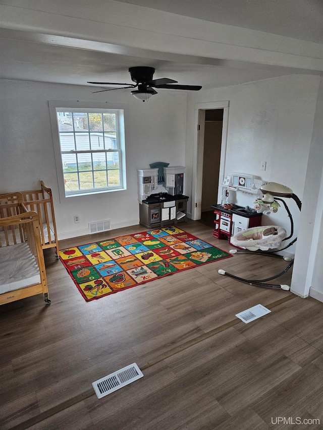 bedroom with ceiling fan and dark hardwood / wood-style floors