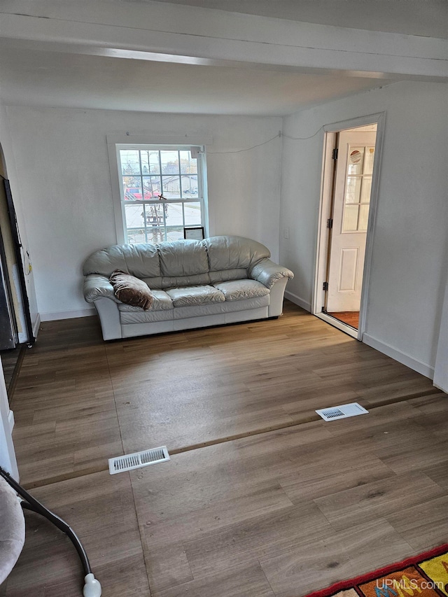 unfurnished living room with hardwood / wood-style floors