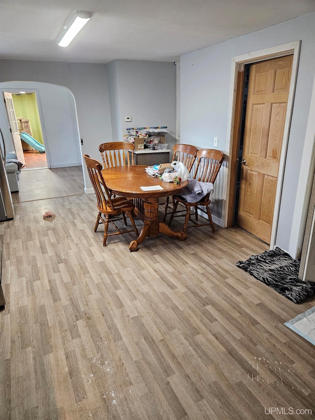 dining area with light hardwood / wood-style floors