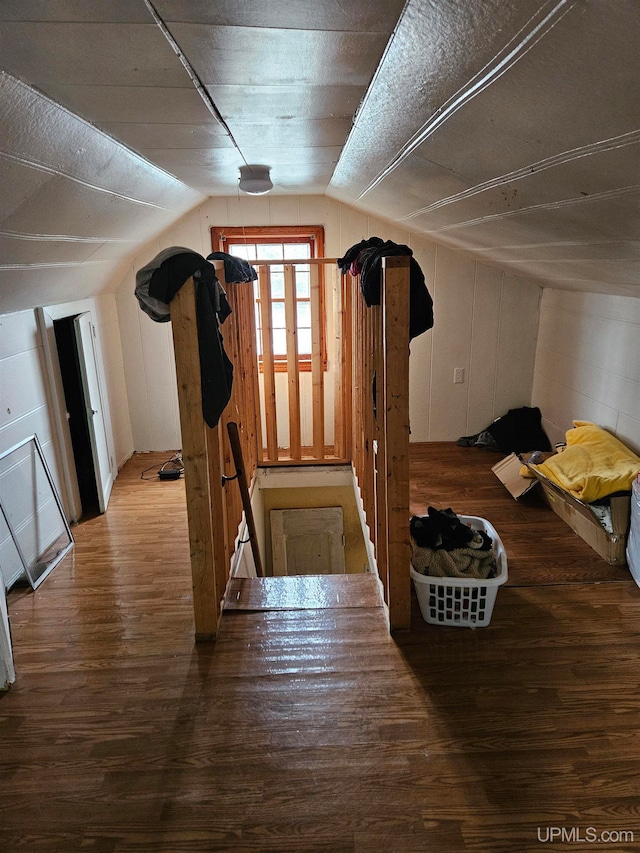 bonus room featuring hardwood / wood-style floors and vaulted ceiling