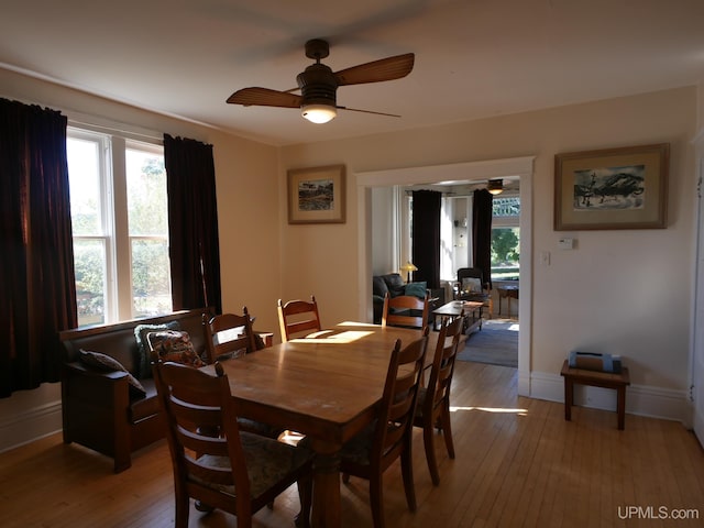 dining space featuring light hardwood / wood-style floors and ceiling fan