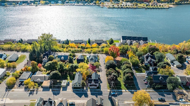 birds eye view of property with a water view