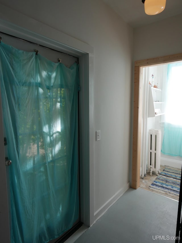 hallway featuring concrete flooring