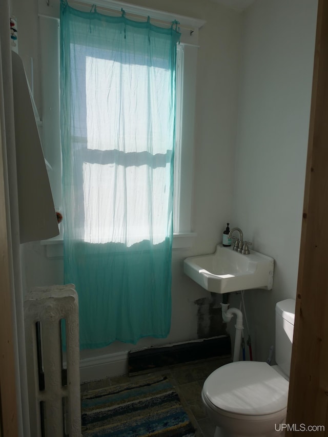 bathroom featuring sink and toilet