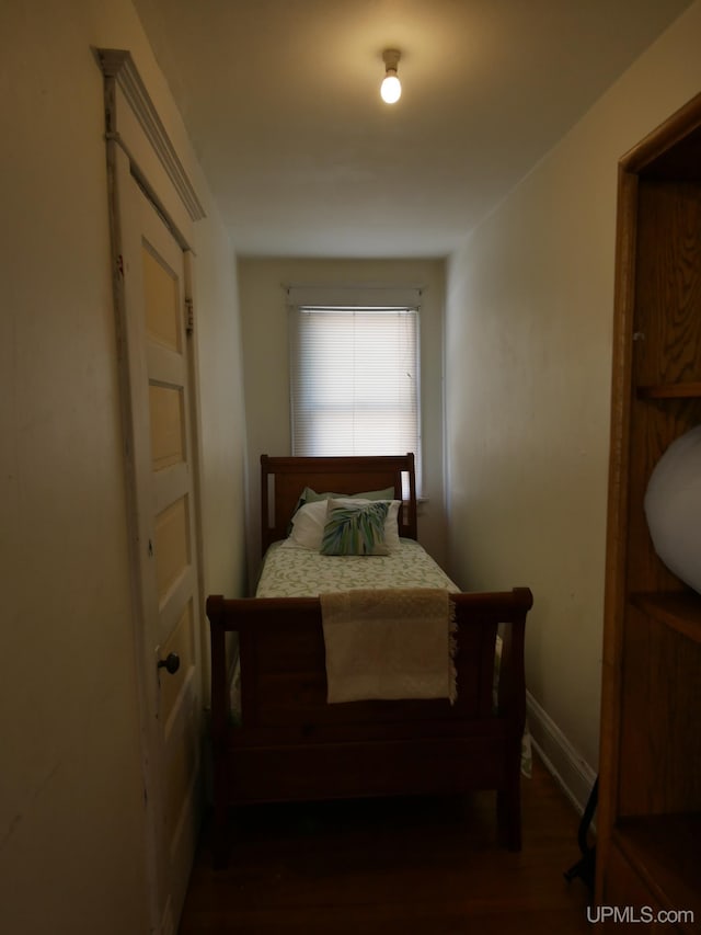 bedroom featuring dark hardwood / wood-style floors