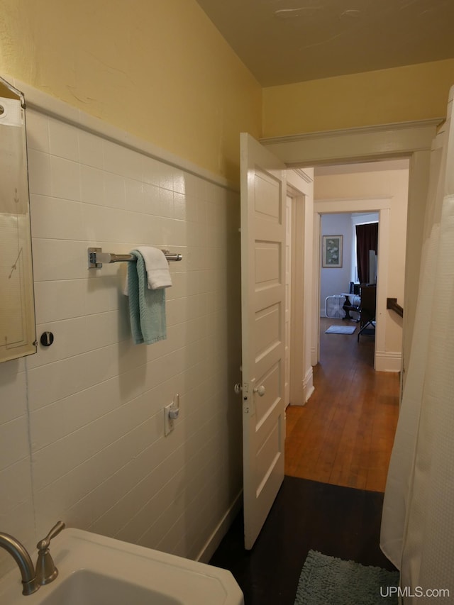 bathroom with hardwood / wood-style flooring and sink