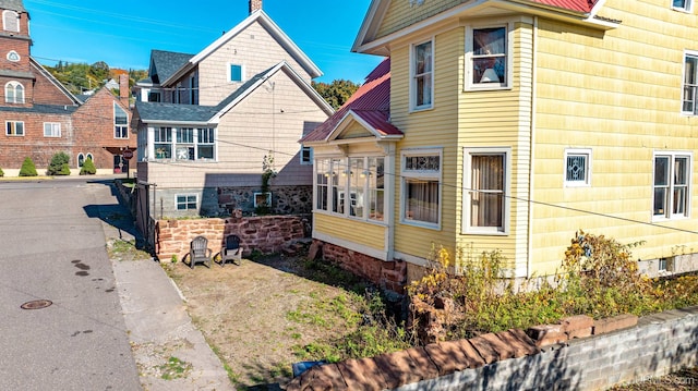 view of front of home featuring a sunroom