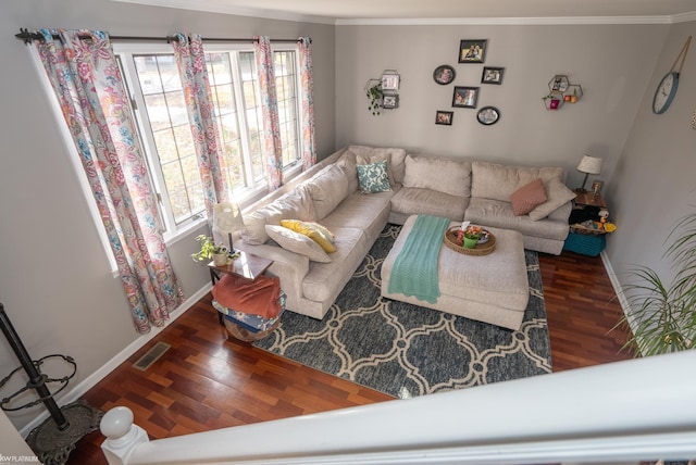 living room with ornamental molding and dark hardwood / wood-style floors