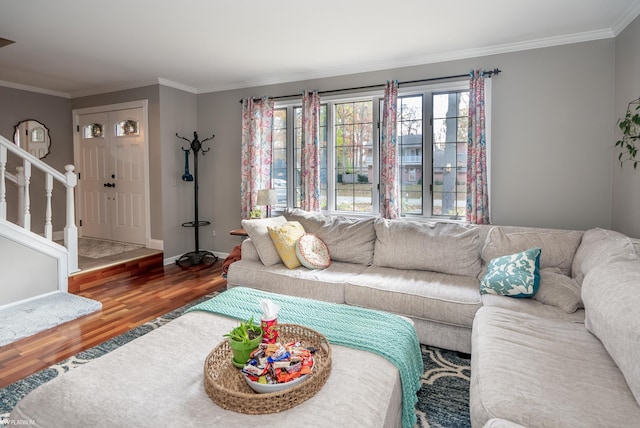 living room with hardwood / wood-style floors and crown molding