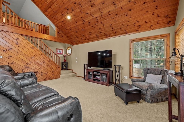 carpeted living room with high vaulted ceiling and wooden ceiling