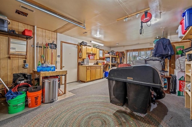 interior space featuring wooden walls and a workshop area