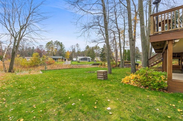 view of yard featuring a wooden deck