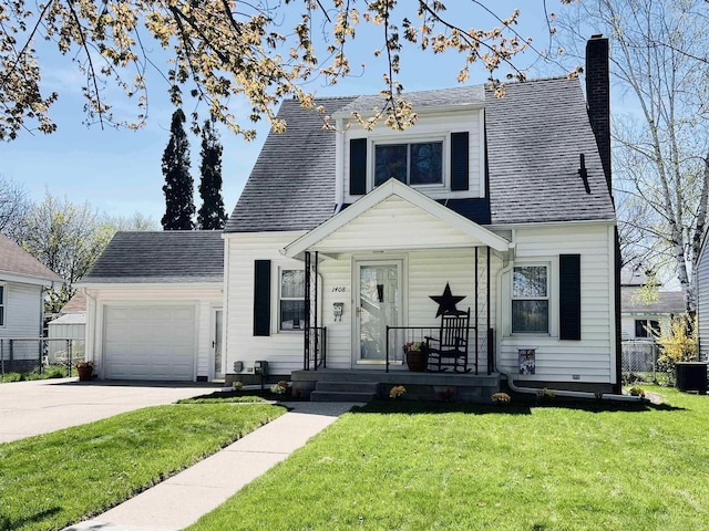 view of front of property featuring a front yard, cooling unit, a porch, and a garage