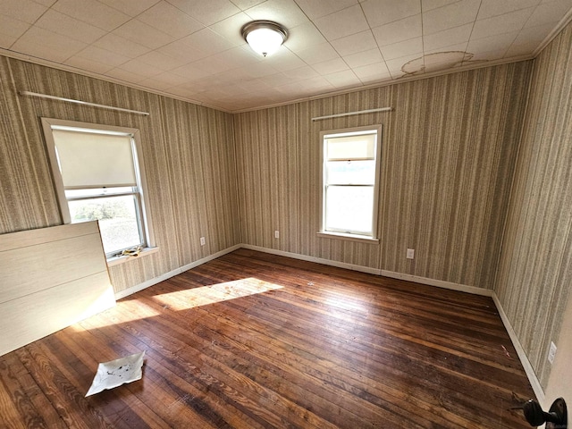 spare room featuring dark wood-type flooring