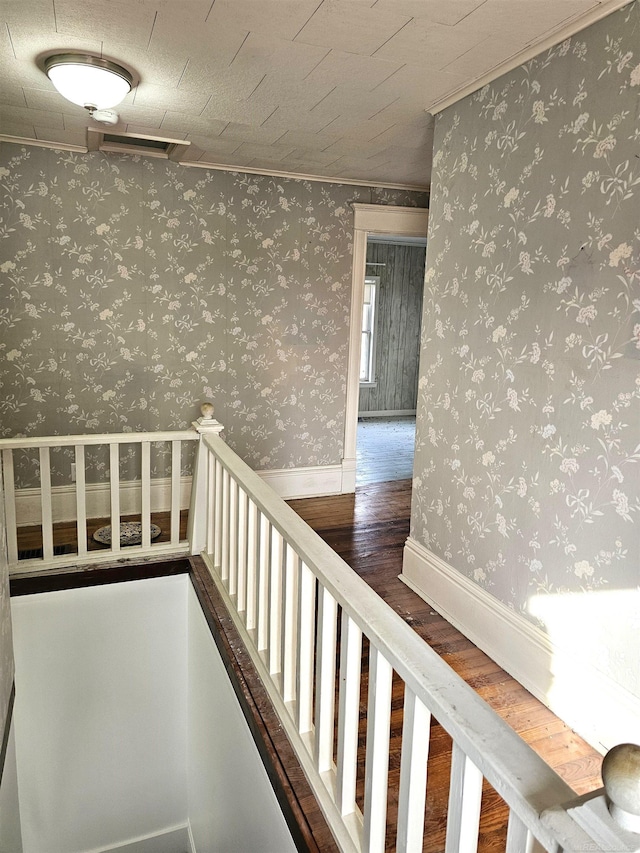 corridor with dark hardwood / wood-style floors