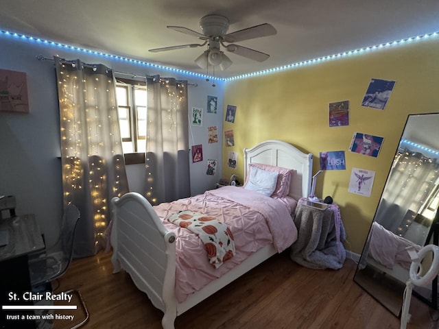 bedroom featuring ceiling fan and wood-type flooring