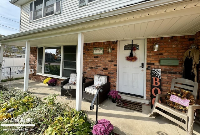 doorway to property with a porch