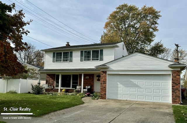 front facade featuring a porch, a garage, and a front lawn