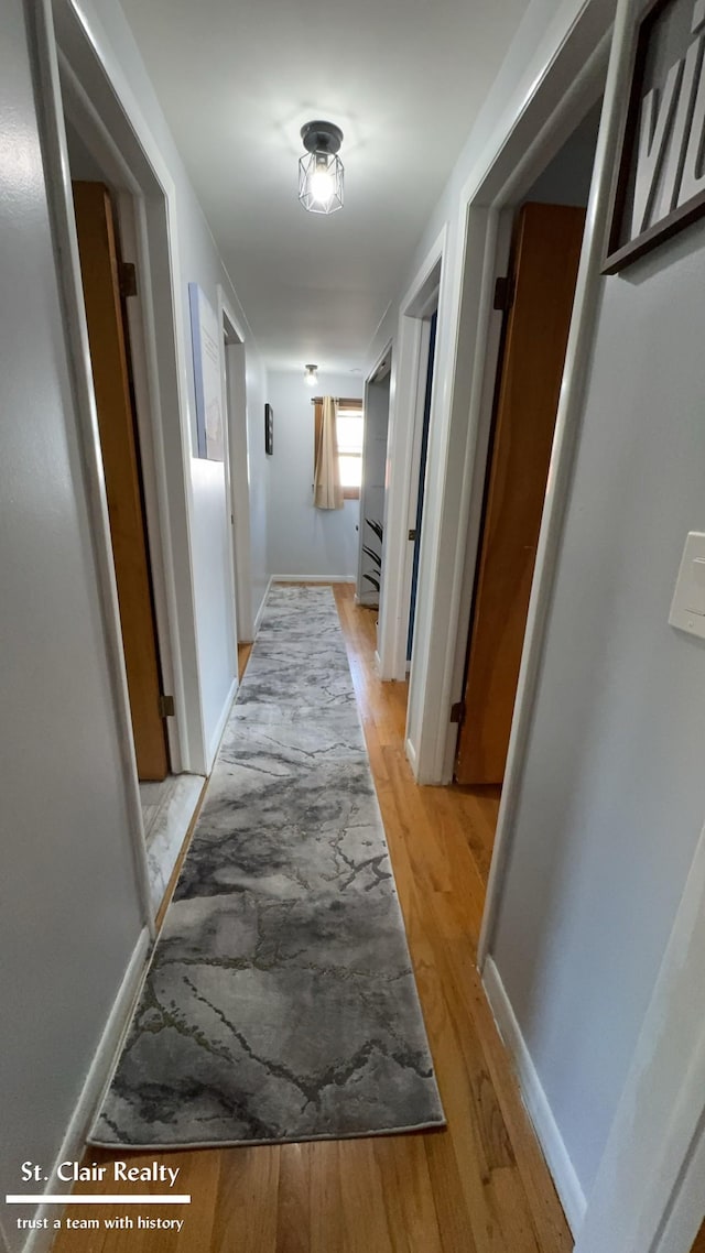 hallway featuring light wood-type flooring