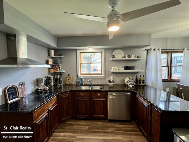 kitchen featuring dark wood-type flooring, sink, stainless steel dishwasher, wall chimney exhaust hood, and cooktop