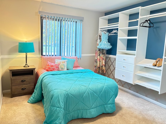 bedroom featuring light carpet