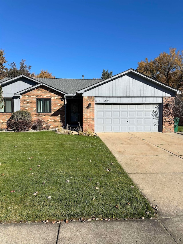 single story home with a garage and a front yard