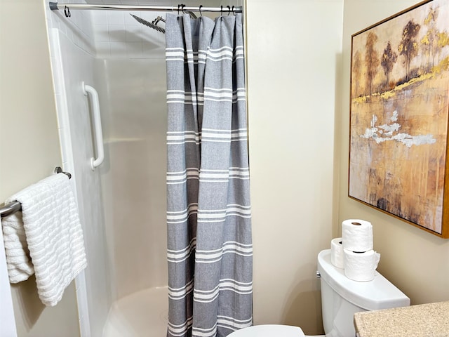 bathroom with walk in shower and toilet