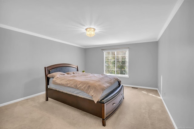 bedroom with crown molding and light colored carpet