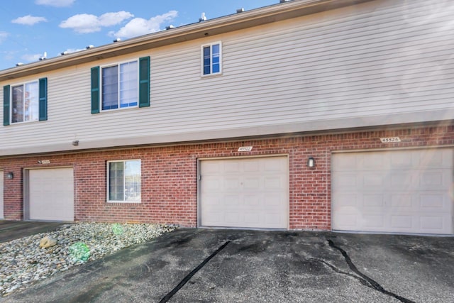 view of side of home with a garage