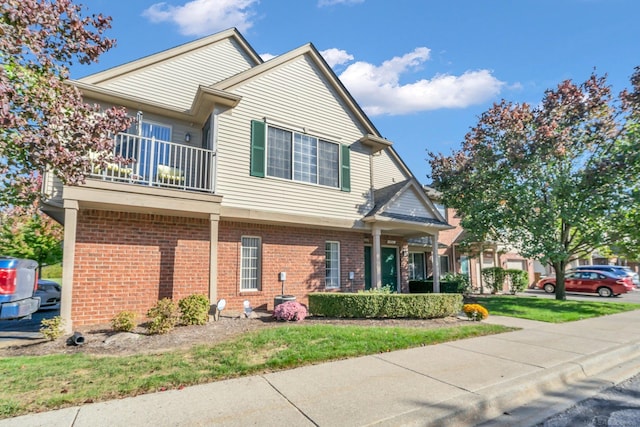 view of front of house featuring a balcony