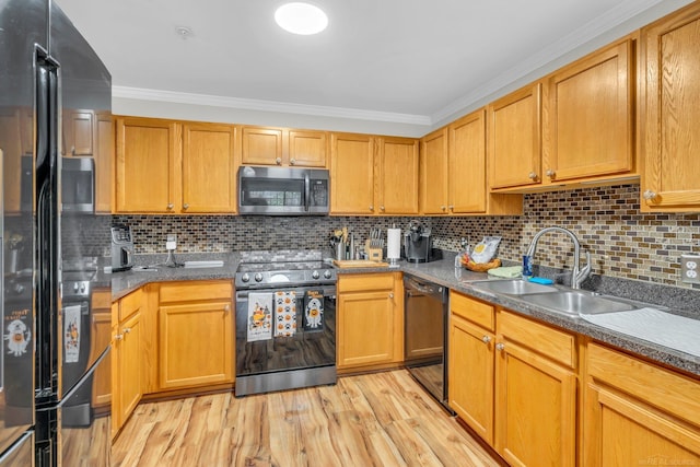 kitchen featuring black appliances, decorative backsplash, crown molding, and light wood-type flooring