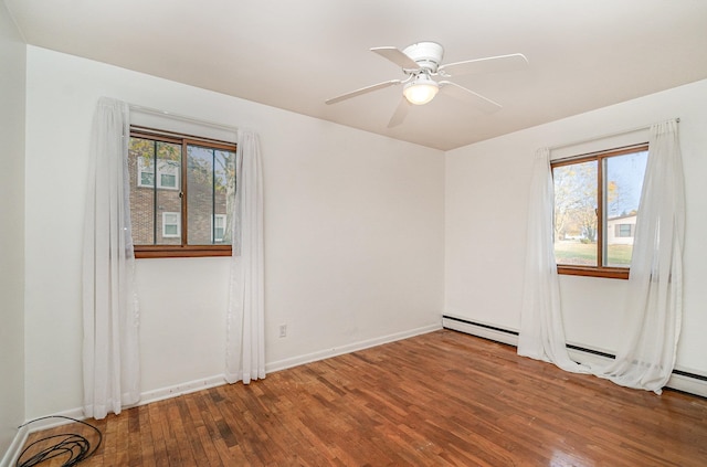 unfurnished room with ceiling fan and hardwood / wood-style floors