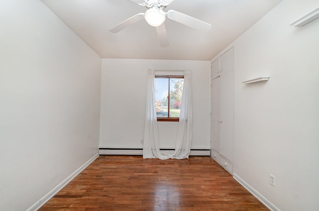 unfurnished room featuring ceiling fan and dark hardwood / wood-style flooring