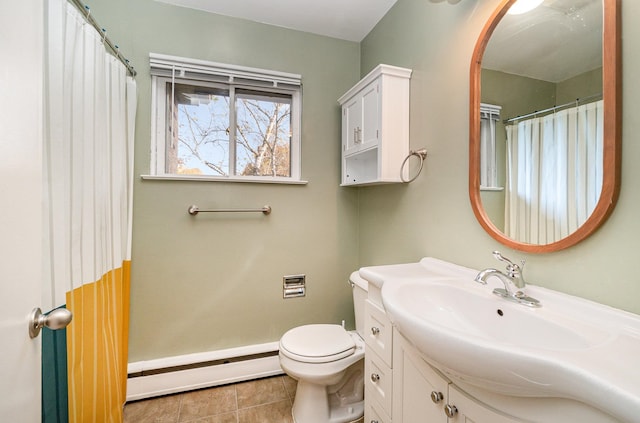 bathroom featuring toilet, vanity, a baseboard radiator, and tile patterned flooring