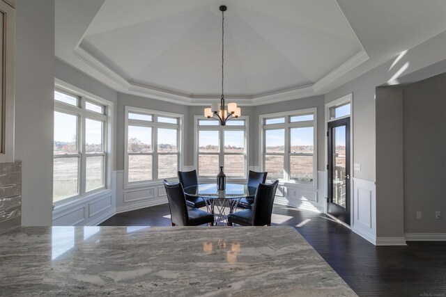 63725 Mulberry Dr, Washington Twp, MI 48095 - dining room with crown molding, a notable chandelier, a raised ceiling, and a decorative wall