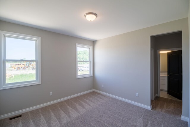 63725 Mulberry Dr, Washington Twp, MI 48095 - spare room featuring carpet floors, baseboards, and visible vents