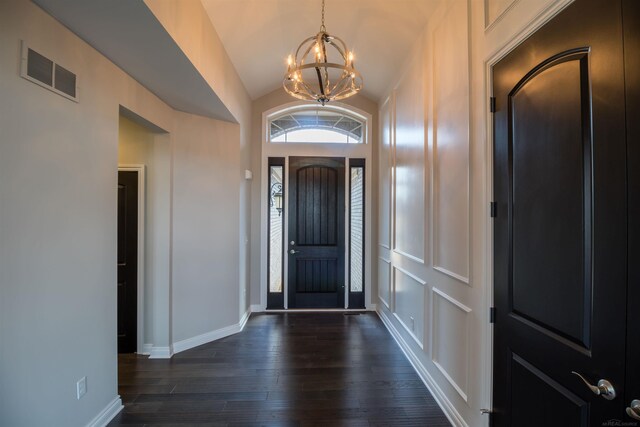 63725 Mulberry Dr, Washington Twp, MI 48095 - foyer entrance with a chandelier, baseboards, vaulted ceiling, visible vents, and dark wood-style floors
