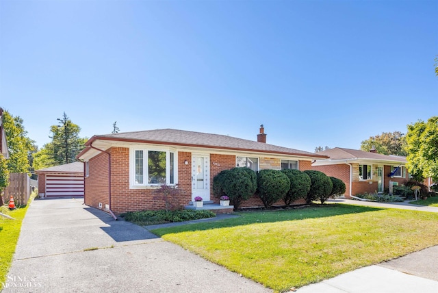 view of front of property with a front yard and a garage