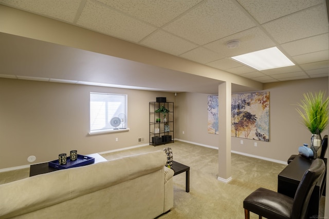 living room with carpet flooring and a drop ceiling