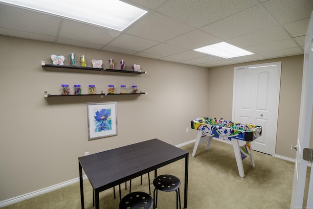 game room featuring light carpet and a paneled ceiling