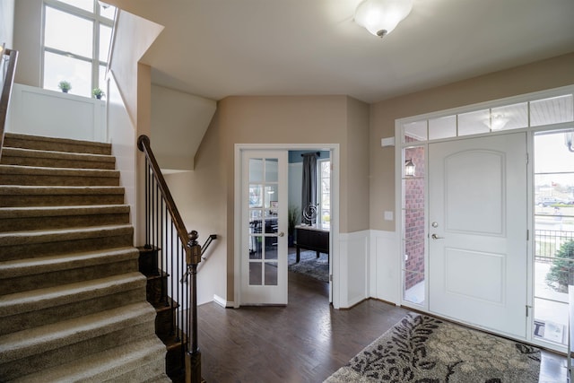 foyer entrance with dark hardwood / wood-style floors