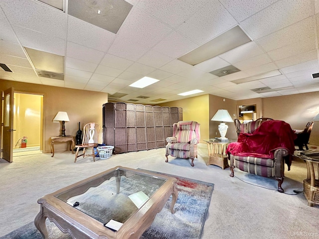 interior space featuring carpet and a drop ceiling