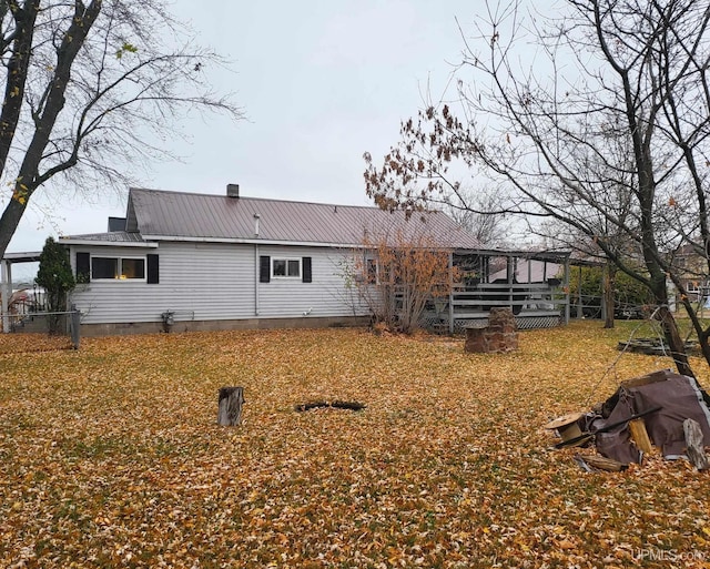 back of house with a yard