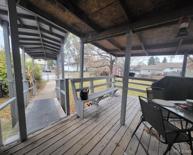 deck featuring a yard and a grill