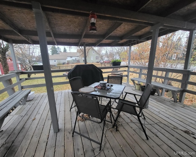 wooden terrace with a grill