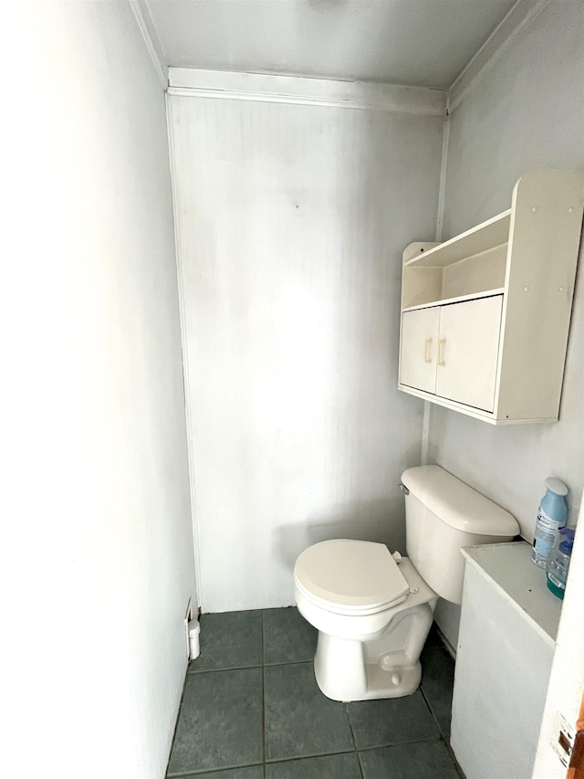 bathroom featuring tile patterned flooring and toilet