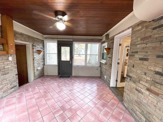 unfurnished sunroom featuring ceiling fan and wooden ceiling