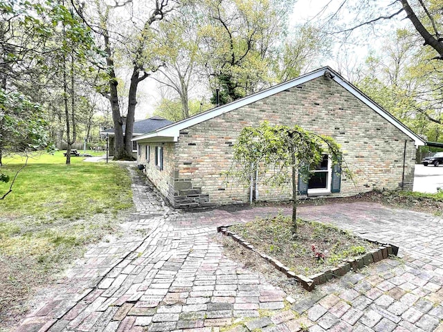 view of home's exterior with a yard