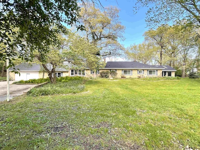 ranch-style house with a front lawn