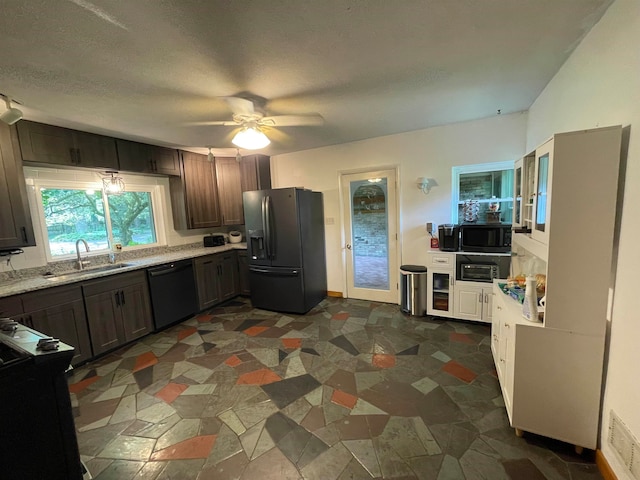 kitchen featuring ceiling fan, sink, black appliances, and dark brown cabinets